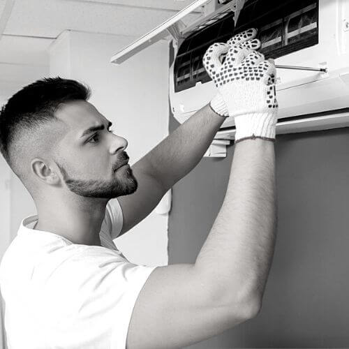 certified technician inspecting ac to repair